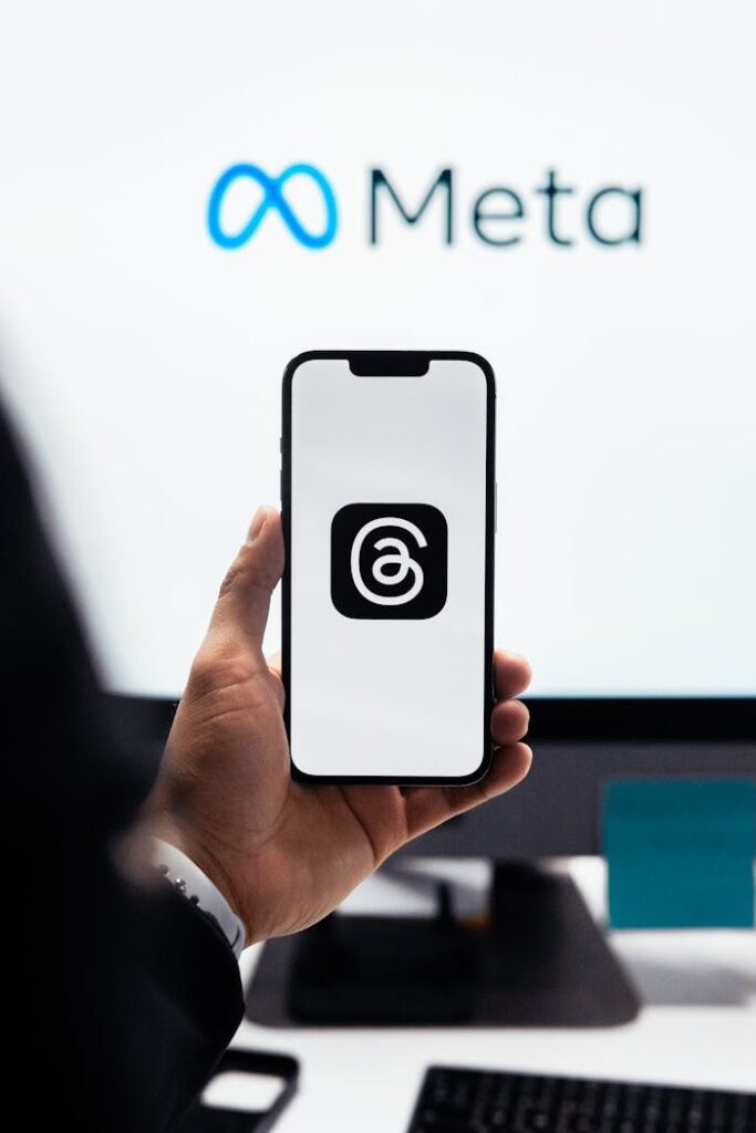 The Art of Drawing Readers In: Your attractive post title goes here Close-up of a person holding a smartphone displaying Meta's threads logo.